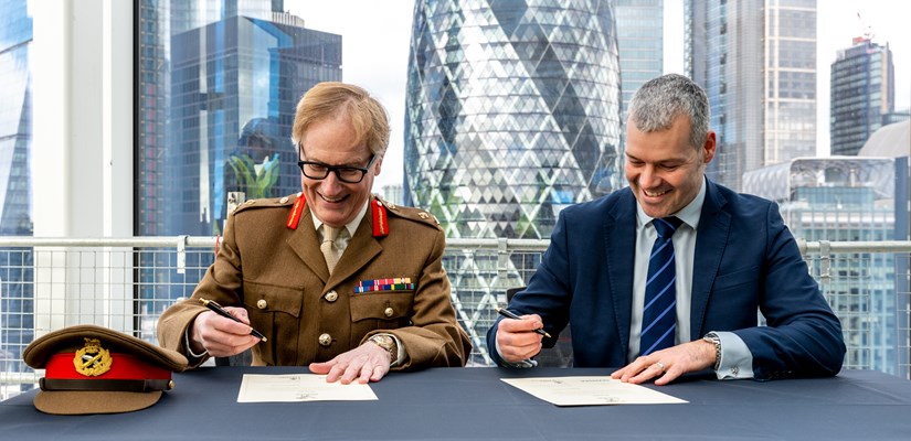 Steve Holbrook and Major General Simon Brooks-Ward sign the covenant